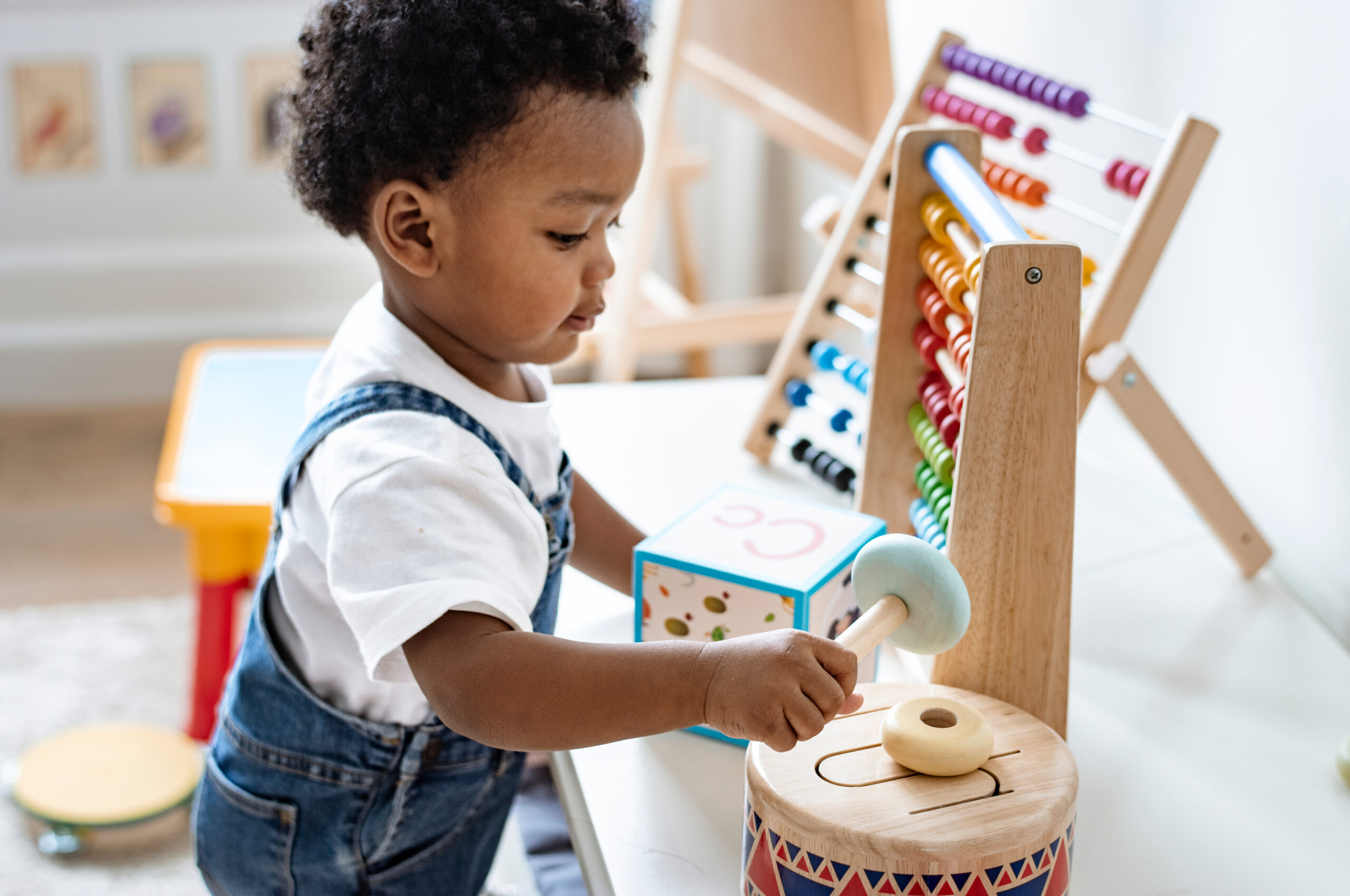 Young,Boy,Playing,With,Educational,Toys Boy Playing with Educational Toys